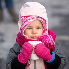 child with hot cocoa